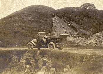 car parked by a small hill